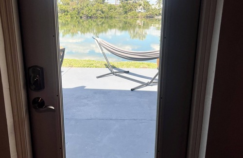 Isles of Capri Apartment | Peaceful Waterfront Efficiency~Dolphins, Manatees and Island Vibes