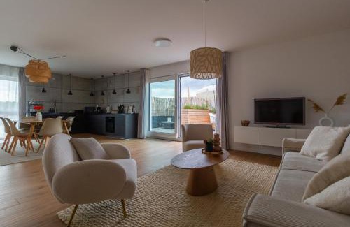 Ehmen Apartment | Penthouse-Ferienwohnung Wolfsburg mit Dachterrasse WLAN Smart-TV überdachter Parkplatz Wallbox