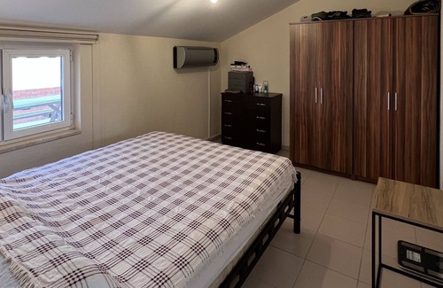 Datca City Center Apartment | Penthouse on the beach, modernly furnished. Above the roofs of Datça.