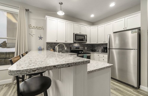 Manistee Condo | Pet Friendly Customized Harbor Village Condo