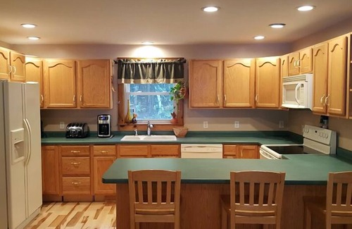 Raymond House | Pet-friendly home on peaceful Raymond Pond with beautiful sunrise views!