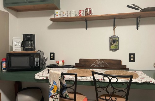 Madison Cottage | Pet friendly Nature Cottage: deck, trails, fire pit, creek, & historic district