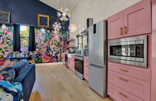 Wimberley House | Pink house with outdoor tub under Wimberley stars