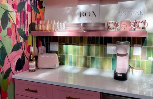 Wimberley House | Pink house with outdoor tub under Wimberley stars