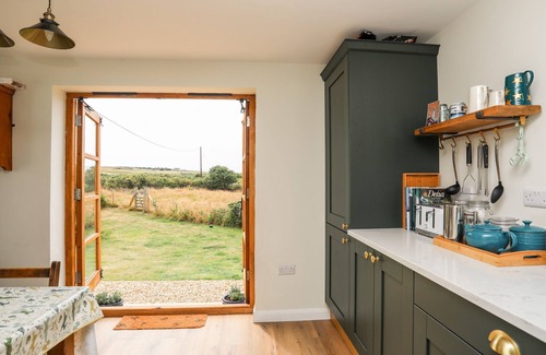 Rhoscolyn Cottage | PLAS COCH RHOSCOLYN, pet friendly, with open fire in Rhoscolyn