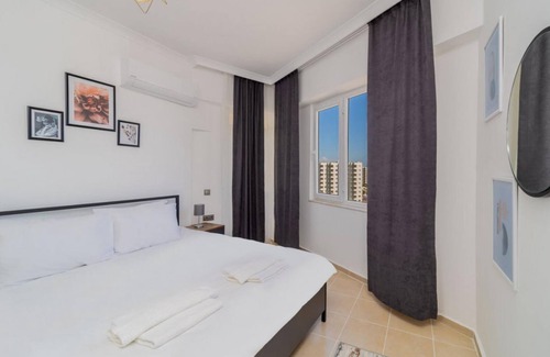 Lara Apartment | Pleasant Apartment with Balcony in Aksu