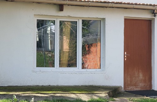 Les Luats Apartment | Pleasant outbuilding in front of a garden in a quiet area