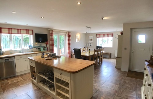 Trevone House | Polcarrek contemporary holiday home with parking and garden. Balcony with rural views