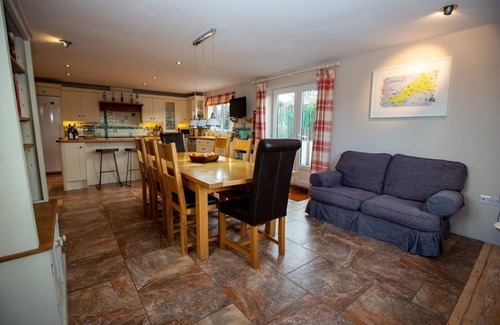 Trevone House | Polcarrek contemporary holiday home with parking and garden. Balcony with rural views