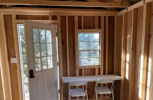 Graham RV Rental | Pondside Primitive Cabin at Lake Godstone