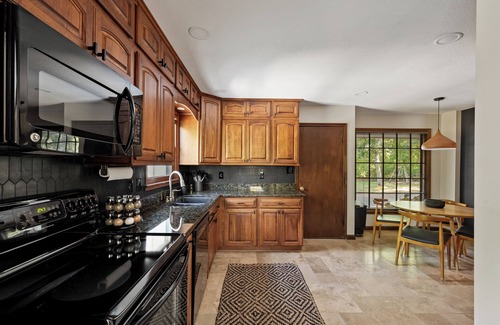 Merriam House | Pool & Hot Tub in the heart of KC! Tons of stylish space inside and out!