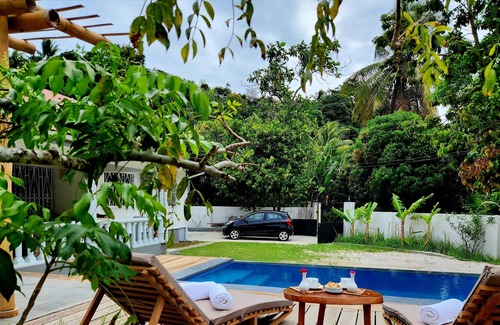 Beau Vallon Villa | Pool villa in Beau Vallon with bamboo dining shelter