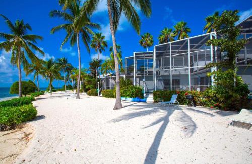 Rum Point Apartment | Pools of the Kai 6 - Beachfront Condo with Private Pool Atrium, Modern Kitchen, and Outdoor Grill