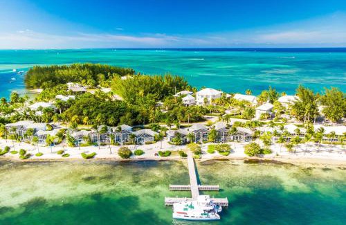 Rum Point Apartment | Pools of the Kai 3 - Waterfront Condo with Private Pool Atrium, Walk to Restaurants