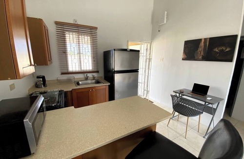 Caribbean Estates House | Portmore Haven: Secure Retreat with Beach Access