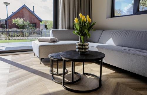 Baarland House | Prachtige bungalow op vakantiepark bij zee.