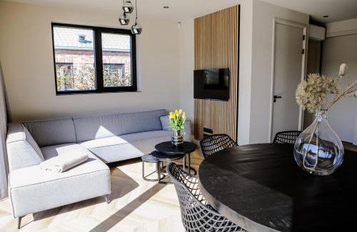 Baarland House | Prachtige bungalow op vakantiepark bij zee.