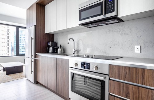 Seaport District Apartment | Practical Seaport 1BR w/Gym, Pool, W/D, Doorman