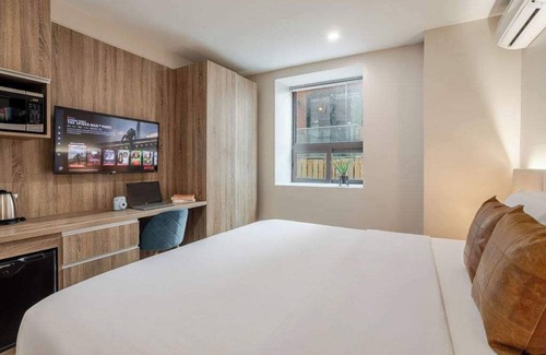 Gay Village House | Prada king– Heart of MTL Stay