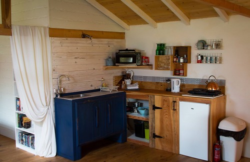 Espinas Cabin | Pretty cabin in beautiful gardens with wood stove & Nordic spa hot-tub/jacuzzi.