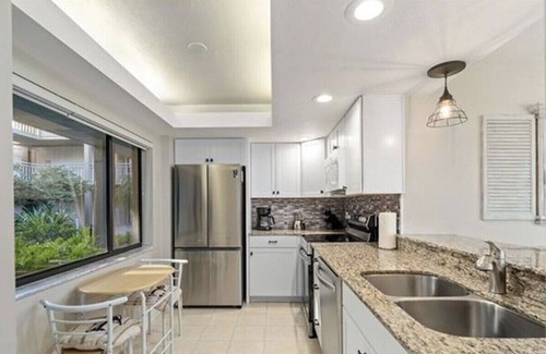 Bonita Bay Apartment | Pristine Corner Unit - Golf Course Views from Quiet Wrap Around Lanai