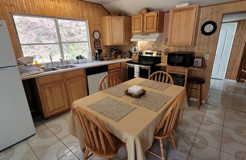 Hot Springs House | Private Cozy Creekside cottage.minutes from town. Hot Tub overlooking creek!