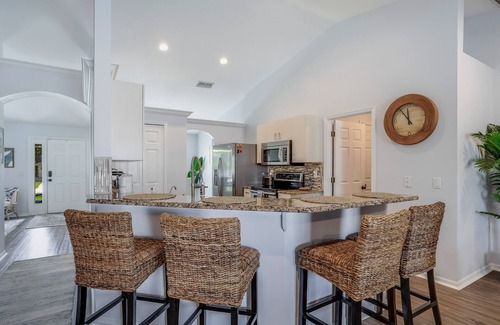 Mariner House | Private home with heated pool, screened lanai, grill, sun deck, & yard games