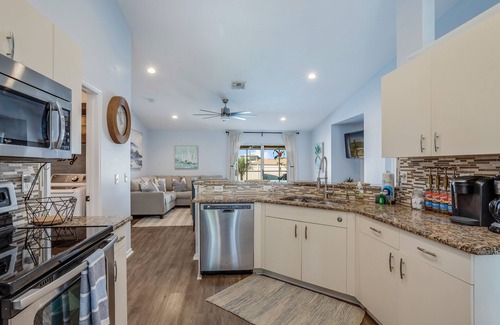 Mariner House | Private home with heated pool, screened lanai, grill, sun deck, & yard games