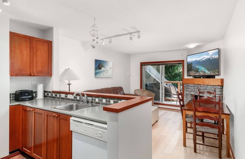 Village North House | Private hot tub, gorgeous view, cozy fireplace, free parking, heated pool!