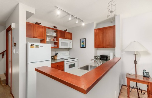 Village North House | Private hot tub, gorgeous view, cozy fireplace, free parking, heated pool!