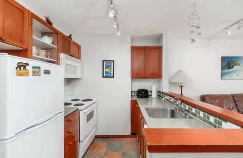 Village North House | Private hot tub, gorgeous view, cozy fireplace, free parking, heated pool!