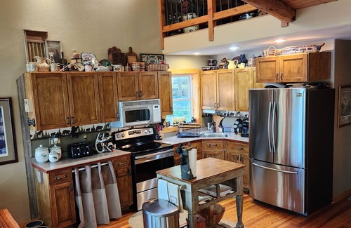 Farwell Cabin | Private lake, with private sandy beach. Beautiful five bedroom.