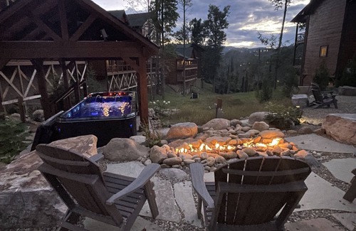 Gatlinburg Cabin | Private Outdoor Space! Waterfall, firepit, arcade Swim Spa, 2 Hottubs
