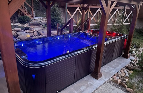 Gatlinburg Cabin | Private Outdoor Space! Waterfall, firepit, arcade Swim Spa, 2 Hottubs
