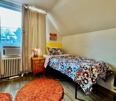Rainier Valley House | Private room with two twin beds air conditioning and shared bathrooms located near SeaTac Airport and Downtown Seattle