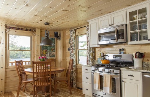 Lochmere Cabin | Private sandy beach, hiking, paddle boards,canoes, kayaks, fire pit,dog friendly
