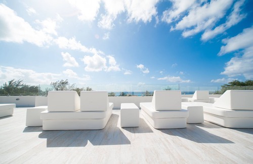 West Bay Condo | Private Seven Mile Beach Club with Roof Terrace, Amazing Pool Pavilion