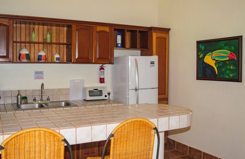 Dominical Apartment | Private suite 102 with beautiful gardens, shared pool and BBQ area!