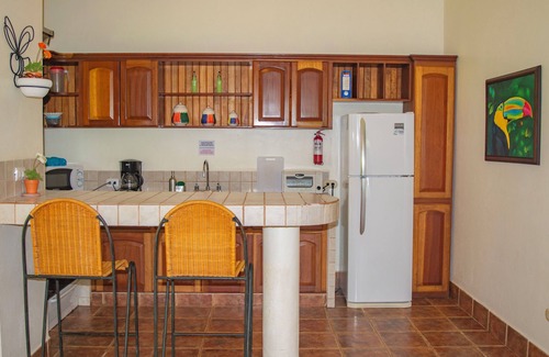 Dominical Apartment | Private suite 102 with beautiful gardens, shared pool and BBQ area!