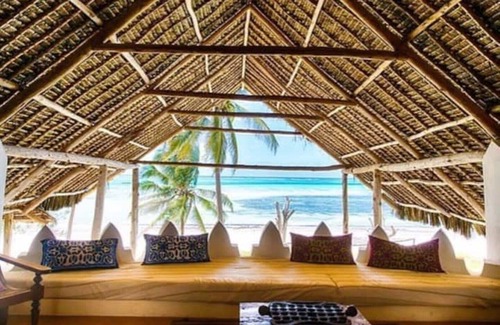 Pingwe Villa | Private Villa with outdoor swimming pool in front of large beach