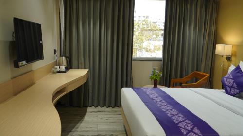 Surat Hotel | Purple Beds by VITS Dwarkesh, Surat