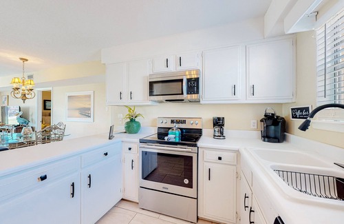 Dauphin Island Condo | Quiet home with WiFi, pool, view of water, & boardwalk to beach