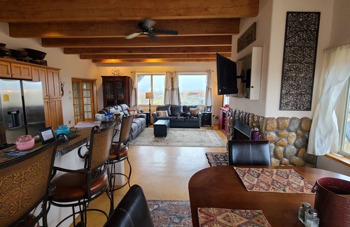 Taos House | Quiet, Pet Friendly Home with Mountain Views. Fenced area for dogs to roam