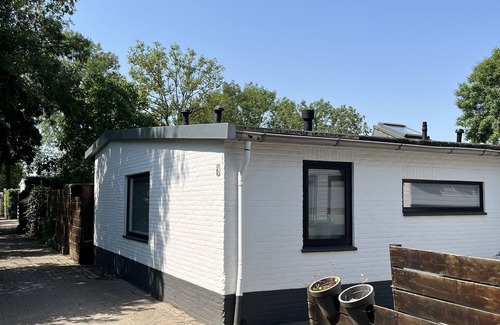 Bruinisse House | Quietly located corner house in Zeeland with generous south-facing terrace