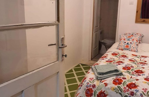 Koppanyszanto Bed & Breakfast | Quirky, character guestroom in loam cottage in rural Hungary with outdoor pool