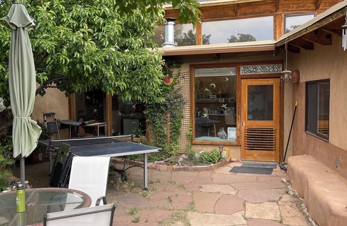 Arroyo Hondo House | Rainbows, Rivers and Sunsets: Unique off-grid solar 3-bedroom home in El Prado