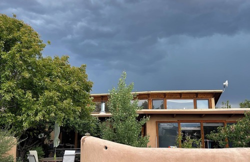 Arroyo Hondo House | Rainbows, Rivers and Sunsets: Unique off-grid solar 3-bedroom home in El Prado