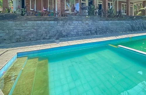Sukaresmi Hotel | RedDoorz near Taman Bunga Nusantara