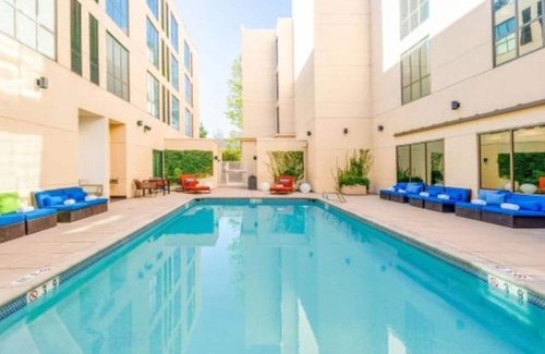 Cupertino House | Redefining travel with weekly live music & poolside yoga!