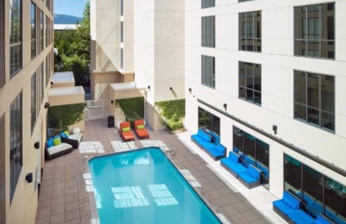 Cupertino House | Redefining travel with weekly live music & poolside yoga!